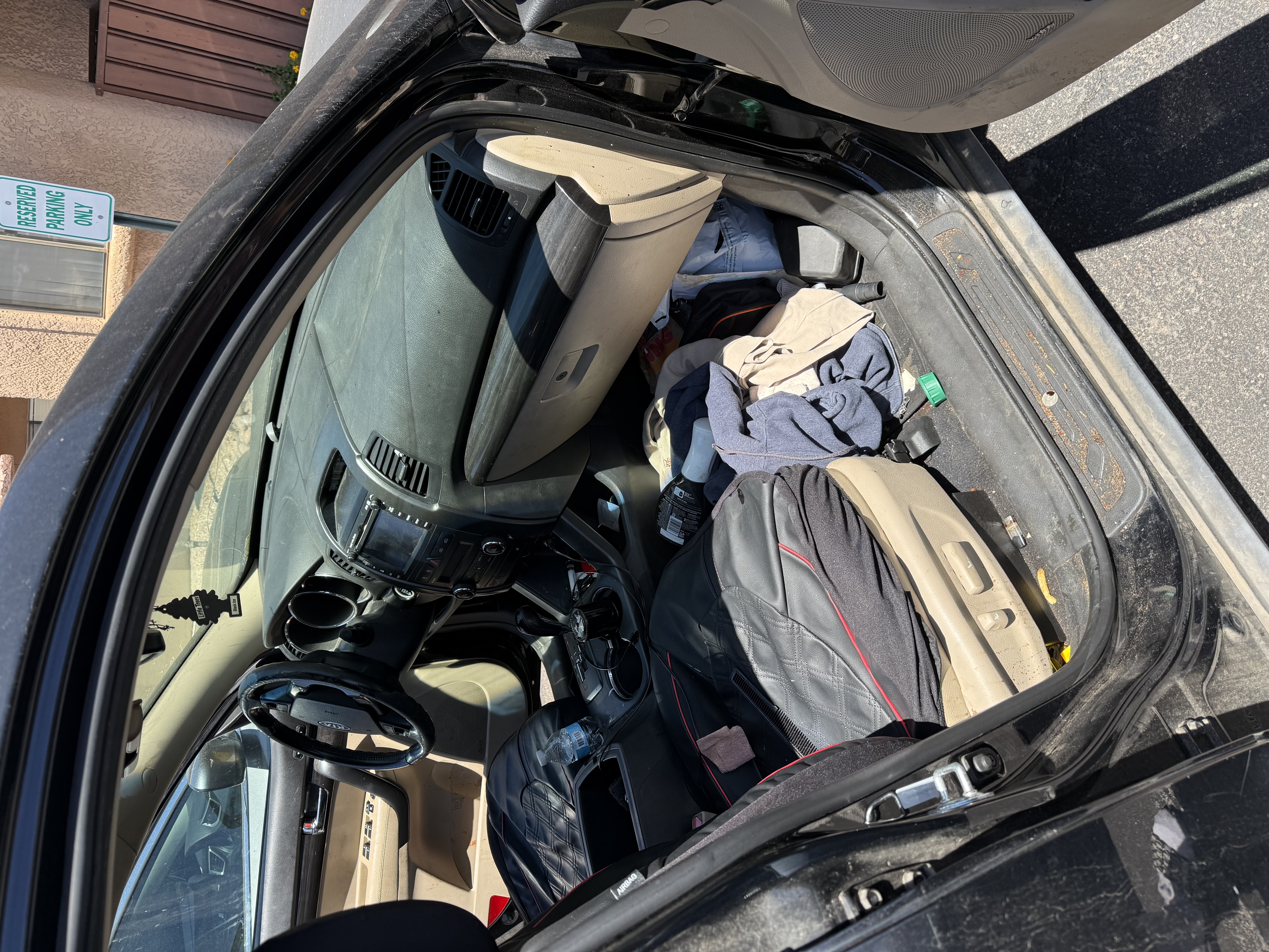 Cluttered front cabin interior before detailing